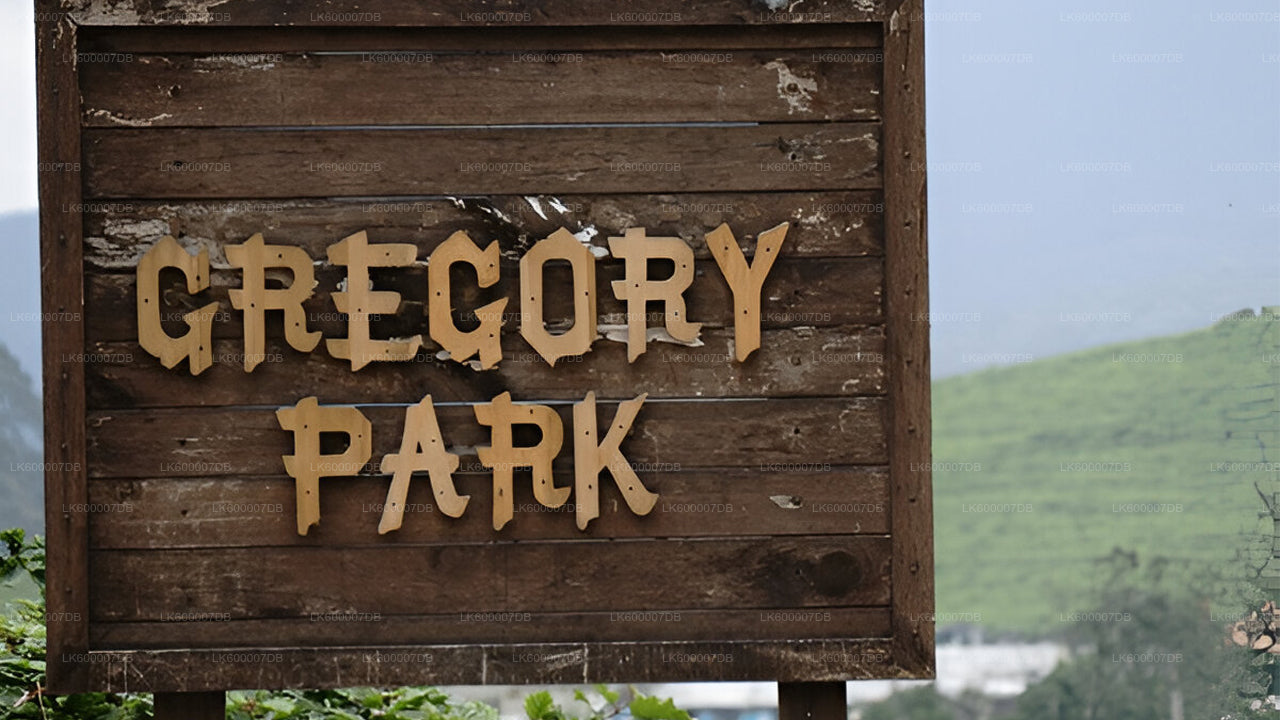 Wooden sign with 'Gregory Park' text against a natural background